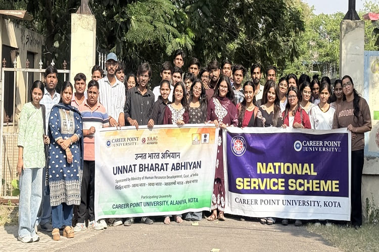 Students singing songs for elderly residents during community outreach programme, Kota